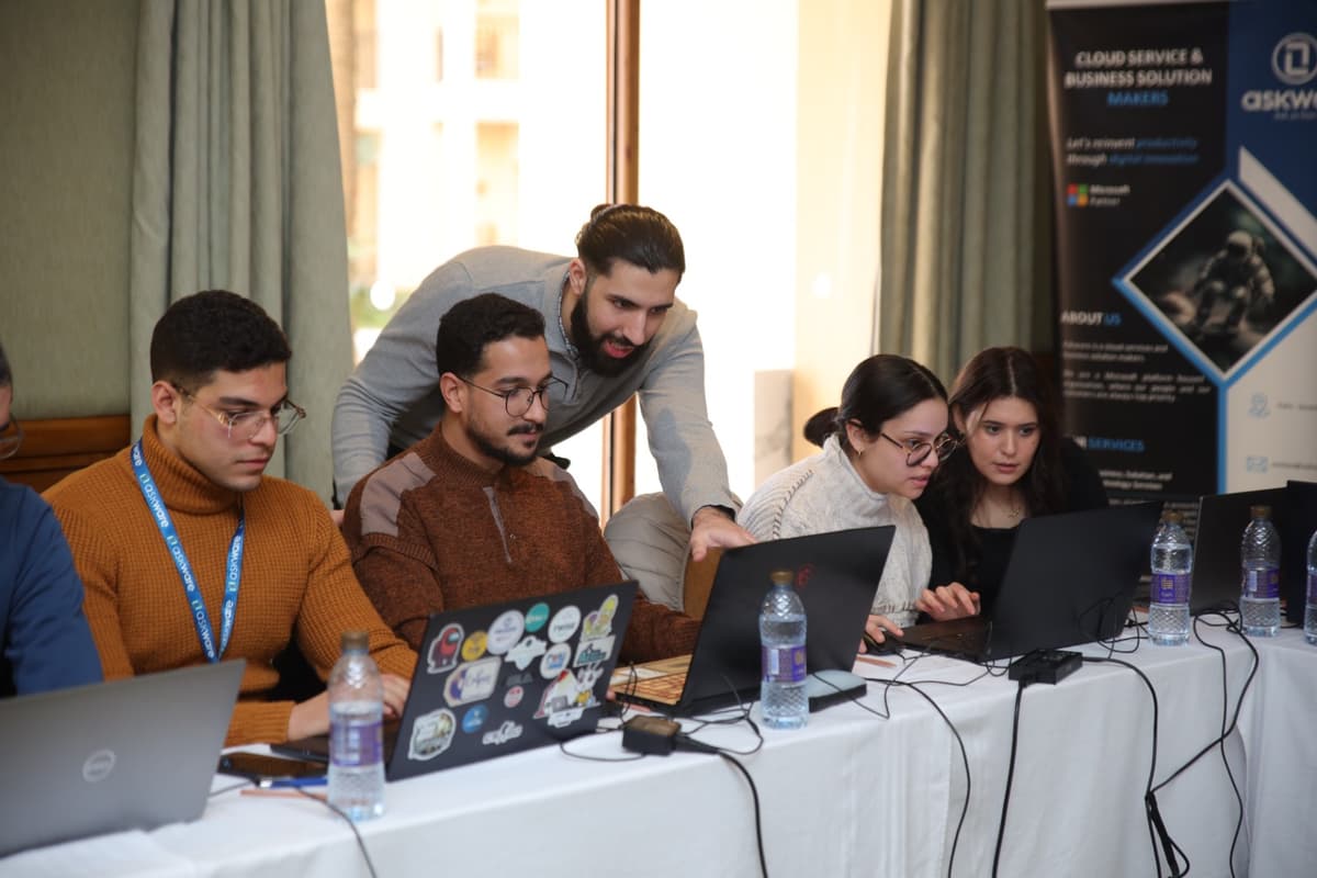 Small group Power Platform workshop session with collaborative problem-solving